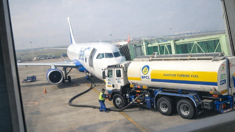 BPCL aviation turbine fuel truck refuelling a commercial aircraft at an airport apron
